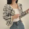 Chaqueta corta de cuadros estilo Chanel en stock