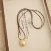 Collar minimalista de cordón negro con colgante de gota de agua ovalada cepillada para mujer, estilo coreano, cadena larga ajustable para suéter, accesorio elegante y versátil