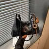 Bolso tipo cartera de empanada modelo 2026 transfronterizo para mujer, de alta gama, para ir al trabajo, gran capacidad, de hombro, bandolera, bolso de mano, bolso casual versátil para mujer