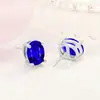Pendientes de botón de moda versátiles y modernos con diamante de color de cuatro garras en forma de huevo Pendientes de botón versátiles para uso diario con garra ovalada Modernos