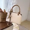 Bolso de mano retro transfronterizo para mujer, nuevo bolso de hombro simple de moda 2026, bolso cruzado versátil de nicho para el día a día