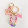 2024 transfronterizo en stock rosa lentejuelas resina 26 letras inglesas llavero colgante mariposa borla accesorios