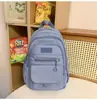 Mochila casual de moda estilo coreano transfronteriza modelo nuevo 2026 bolsa escolar de gran capacidad mochila versátil linda de moda para mujer