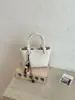 Comercio exterior transfronterizo bolso de mano pequeño para mujer nuevo de alto valor retro para el trabajo diario bolso tipo cubo bolso cruzado de un solo hombro moderno