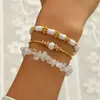 Pulsera de Pulsera de Piedra Blanca y Perlas de Arcilla Suave y Perlas Doradas de Nuevo Estilo Transfronterizo Europeo y Americano Set de Tres Piezas de Joyería de Mano