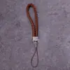 Lanyard para teléfono móvil al por mayor de fábrica, cordón para llavero de cámara de cuero PU, cuerda de muñeca para teléfono móvil de pareja, cuerda tejida de cuero