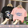 Ropa para niños para niños, camiseta de manga larga de retazos, imitación de dos piezas, camiseta base de algodón puro para niños mayores, nuevo estilo de top para primavera y otoño 2026
