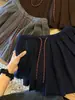 Falda corta plisada de punto gris estilo colegial para mujer, nueva y versátil de cintura alta, entalladora, línea A, otoño/invierno 2026