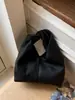 Bolso de Mano Plegado de Diseño de Nicho para Mujer 2026 Nuevo Bolso de Hombro/Axila de Gran Capacidad para Viajes Diarios Estilo Coreano Bolso Cubo