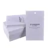 Elevador de ropa colgador de ropa personalizado impresión personalizada hebilla anti-desgarro de alta calidad etiqueta de PVC tarjeta pequeña redonda creativa