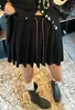Falda corta plisada de punto gris estilo colegial para mujer, nueva y versátil de cintura alta, entalladora, línea A, otoño/invierno 2026