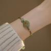Madera de agar ruxie paso periférico pulsera desprendible cara luz mismo estilo pulsera femenina pulsera abierta imitación jade Hetian maceta de loto pulsera estilo antiguo
