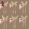 Pasador de Metal Mariposa Transfronterizo, Colgante de Borla para Cabello a Medio Recoger Femenino y de Alta Gama 2024 Clip para la Parte Posterior de la Cabeza del Festival de los Faroles