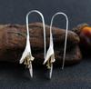 Pendientes largos de plata 925 para mujer, elegantes y modernos, con diseño de flores, hechos a mano, para rostros finos y estilo frío.