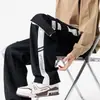 Pantalones rectos de moda con múltiples bolsillos para hombre, corte casual holgado, talla grande, estilo americano, versátiles pantalones cargo deportivos para primavera y otoño