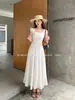 Xiu Xixi Líneas Trece Verano 2026 Elegante y Gracioso Cuello Redondo Color Sólido Cintura Alta Vestido de Tencel para Mujer 68575