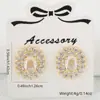Distrito Lu Europa y Estados Unidos INS moda lujo circonita geométrica pendientes femenina nicho exquisito alta gama pendientes al por mayor