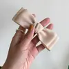 Pinza para el pelo Clip lateral Nuevo Corea del Sur clip lateral tocado simple elegante lazo pasador pequeño flequillo clip de resorte lateral dulce