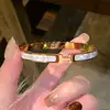 Pulsera de acero de titanio transfronteriza, anillo abierto liso de lujo discreto, apilable versátil, joyería que no se decolora de la fábrica de origen