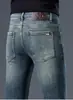 Jeans Blancos de Alta Gama Estilo Europeo a Prueba de Tres Elementos para Hombre, Corte Delgado, Elásticos, Pantalones Cónicos, Versión Forrada de Felpa Otoño e Invierno 2026, Cálidos