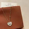 Bestseller de Xiaohongshu Set de Cuatro Piezas Concha Corazón Circonita Cruz Sonriente Circonita Trébol de Cuatro Hojas Colección Dropshipping