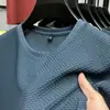 Camiseta de Malla de Bambú Elástica Nueva de Seda Helada para Hombre de Manga Corta con Cuello Redondo Manga Media Camiseta Interior para Hombre Delgada de Verano Moderna