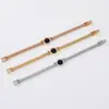 Acero de titanio chapado en oro rosa letras retro pulsera redonda negra joyería para mujer fabricantes al por mayor