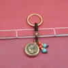 Adorno de llavero Pixiu de latón, amuleto de los doce animales del zodiaco, colgante giratorio, cordón de cuentas azules, calabaza de la suerte, venta al por mayor