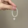Mini Labubu Cuarta Generación Caja Sorpresa Ropa de Muñeca Collar Colgante Labubu 26 Letras Collar de Perlas Accesorios de Joyería