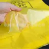 Bolsa de basura médica engrosada amarillo hospital plástico médico bolsa de boca plana tipo chaleco bolsa de embalaje para residuos médicos Material nuevo