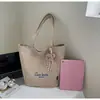 Bolso tote grande de estilo casual para mujer, nuevo bolso de mano ligero color neón con diseño de corazón, adecuado para estudiantes universitarios que van a clase.