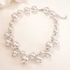 Collar de Metal Plegado Ovalado con Borla Transfronterizo Europeo y Americano, Lujo Ligero, Cadena de Clavícula de Gama Alta, Joyería Única y Exagerada para Mujeres
