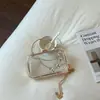Tendencia transfronteriza bolso de mano caja brillante personalizado para mujer, nuevo bolso cruzado de hombro único tipo sillín verano 2026