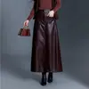 Falda versátil de cuero PU de cintura alta adelgazante para mujer, nueva moda otoño 2026, falda larga elegante y simple de línea A, moderna