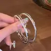 Pendientes de Aro Plateados Giratorios Exagerados, Pendientes Grandes Trenzados Populares, Diseño de Nicho, Accesorios para Orejas Únicos y Hermosos de Gama Alta