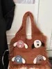 2025 Nuevo Bolso de Mujer Tejido Versátil de Hombro Único de Punto Popular de Comercio Exterior Otoño e Invierno con Bloques de Color Artísticos y Borlas
