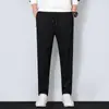 Pantalones casuales gruesos para hombre de primavera y otoño, joggers deportivos holgados de cintura alta de corte slim versátiles con cremallera y perneras rectas