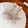 Aretes Metálicos Plegados de Estrella de Mar Estilo Europeo y Americano Transfronterizos Aguja de Plata Nuevo Estilo 2026 Estilo Vacacional Adornos para Orejas Sensación de Lujo Ligero Alta Gama