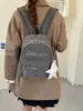 Mochila com estampa de estrelas, grande capacidade, simples e versátil, adequada para estudantes, estilo coreano, com estampas de letras e um visual preppy de faculdade.