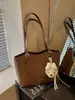 Bolso tote de alta gama de moda para mujer, nuevo bolso de hombro versátil de moda 2026, bolso grande simple y elegante