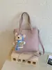 Bolso Cubo Trendy Coreano para Mujer Primavera 2026 Nuevo Bolso Tote de Nicho con un Toque de Lujo para el Trabajo y Uso Cruzado