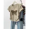 2025 Nuevo Estilo de Verano Modal Nicho Bordado Cintura Plisada Asimétrica Cuello Redondo Manga Corta Camiseta Tops para Mujer Ins
