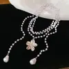Elegante collar de flores y perlas multicapa estilo francés para mujer, moderno y versátil, realza el temperamento, cadena para la clavícula con un toque de lujo ligero y de alta gama