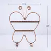 Nuevo y lindo expositor de pendientes de mariposa al por mayor moda exquisitos pendientes estante para joyas estante de joyas de hierro