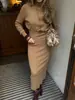 Conjunto de Suéter de Gola Alta Elegante e Versátil com Caimento Justo + Saia - Novo Estilo Outono e Inverno 2026 Europeu e Americano Transfronteiriço