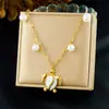 Moda Transfronteriza Chapado en Oro Multi-Elemento Hueco Flor de Amor Cereza Colgante Collar Personalizado Versátil Concha Lazo