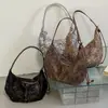 Otoño 2026 Nuevo Simple Elegante Estilo Coreano Ins Estilo Perezoso Alta Apariencia Viaje Bolso Cruzado Trendy Tipo Dumpling Mujer