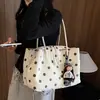 Bolsa de ombro super popular estilo coreano com bolinhas 2026 nova bolsa vintage com múltiplos compartimentos para trabalho e deslocamento