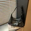 Textura de nicho color retro bloque de color lunares 2026 otoño nuevo elegante simple gran capacidad versátil bolso de hombro cruzado