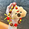 Llavero de dibujos animados creativos kappi bala de cara giratoria lindo colgante para mochila escolar llavero para llaves de coche pequeño regalo al por mayor